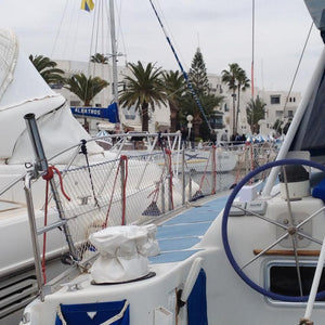 Customer photo of bespoke white netting around boat rails.
