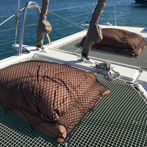 Bespoke elasticated nets for covering cushions on a boat deck (customer photo).