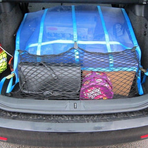 A combination of a mesh net with webbing and and elastic net to control a load in a car boot (customer photo).