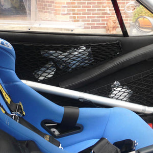 Bespoke frame elastic nets shaped to provide custom storage space inside a car door (customer photo).