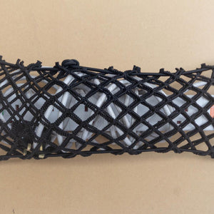 Custom double layer elastic net pouch for storage of an extension cord.