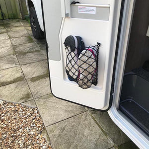 Custom frame elastic net for shoe storage at the back of a van with shoes in place (customer photo).