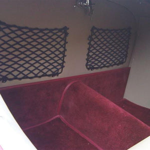 Frame elastic nets custom-made for the interior of a classic car.