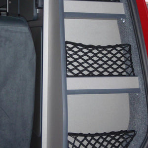 Custom-made frame elastic nets to hold items within shelving at the back of a van (customer photo).