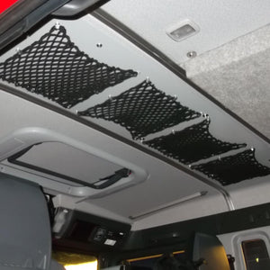Bespoke elastic nets to store helmets on the roof of a fire truck (customer photo).