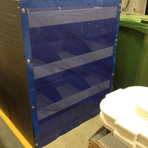 Bespoke mesh net with turn buttons covering shelving in a vehicle (customer photo).
