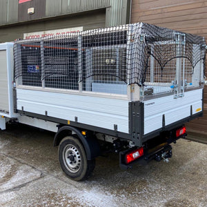 Cargo net covering a trailer on a vehicle to help contain the load (customer photo).