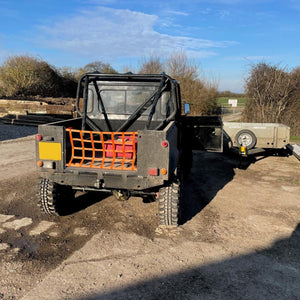 Custom orange webbing cargo net to fit the back of a Land Rover (customer photo).