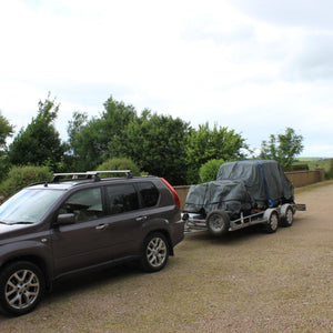 Bespoke load control net to cover a car on a trailer (customer photo).