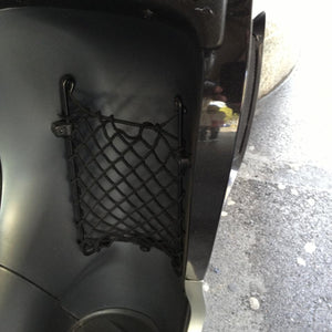 Close-up of small bespoke elastic net to provide storage for a water bottle on a motorcycle (customer photo).