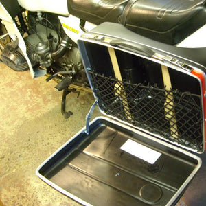 Bespoke frame elastic net to fit within a metal motorcycle pannier to provide additional storage space (customer photo).