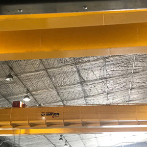 Safety netting under a roof inside a warehouse.