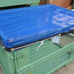 Blue mesh stillage cover with bungee cord.
