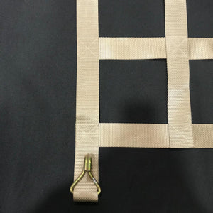 Close-up of custom tan colour webbing cargo net showing metal end hook.