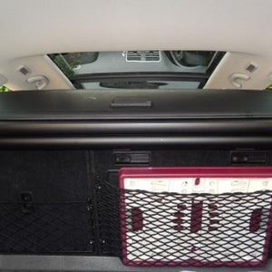 Custom frame elastic net for storage in the boot of a VW Passat (customer photo).