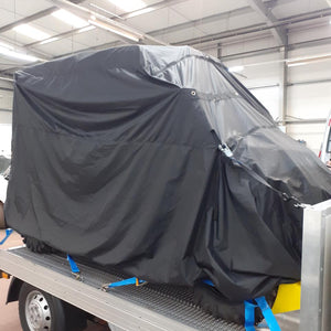 Bespoke load control cover for a car on the back of a truck (customer photo).