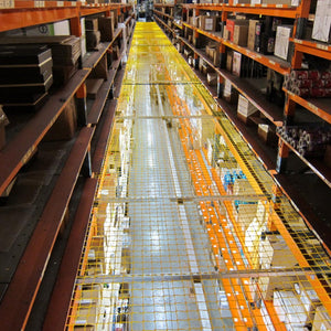 Yellow knotted netting in a warehouse.