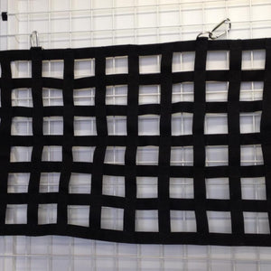 Bespoke black webbing cargo net with integrated D Rings.