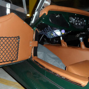 Frame elastic nets custom-made for the interior of a classic car (customer photo).