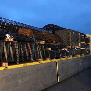 Customer photo showing extra heavy duty cargo nets as part of a load control solution on the back of a truck.