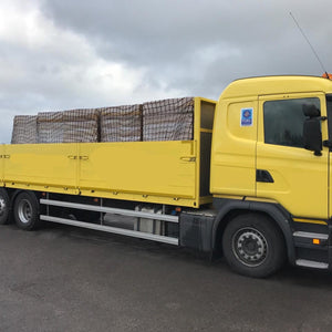 Customer photo of one of our extra heavy duty cargo nets covering a load in the vehicle bed.