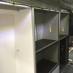 Bespoke non-elastic cargo net with bungee cord and plastic hooks in front of shelving (customer photo).