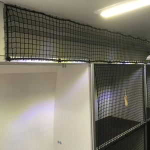 Bespoke non-elastic cargo net with bungee cord and plastic hooks in front of shelving (customer photo).
