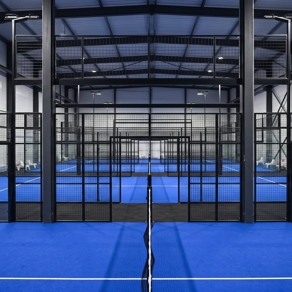 Padel court divider net for ball containment and court separation