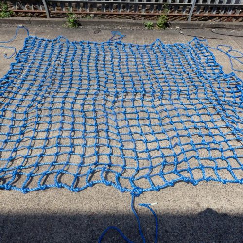 Blue knotted net with tie ropes