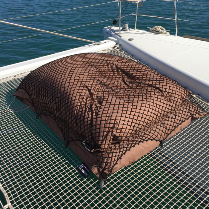 Bespoke elasticated net for covering cushions on a boat deck.