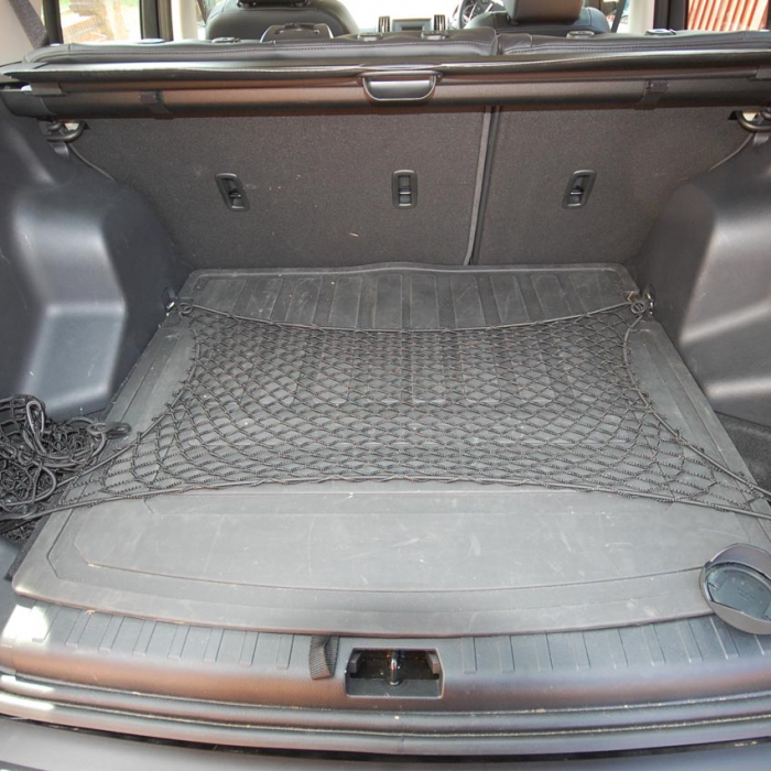 Bespoke elastic net to cover the area in a car boot.