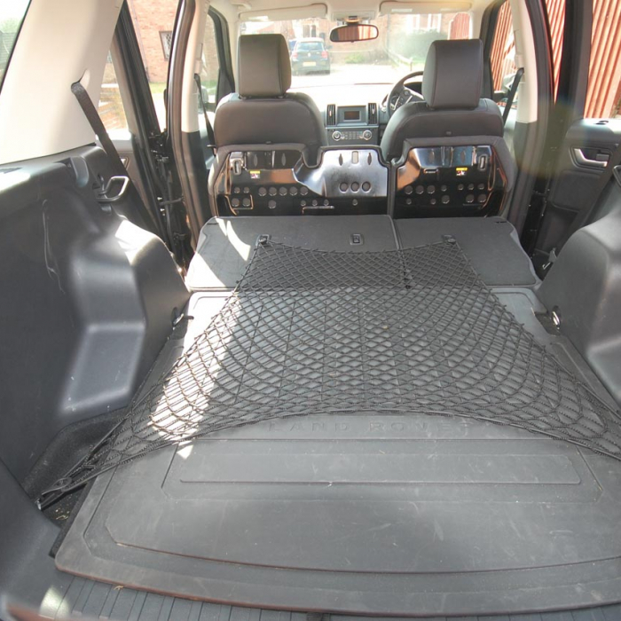 Bespoke elastic net to cover the area in a car boot and the rear seats when they are folded down