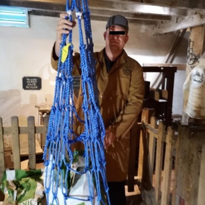 Blue rope hoist net in use