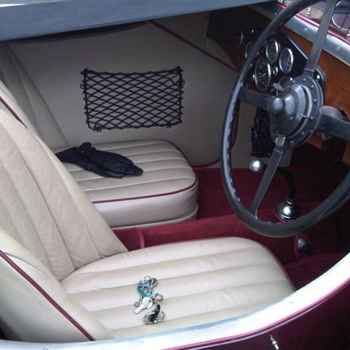 Custom frame elastic net for the interior of a classic car.
