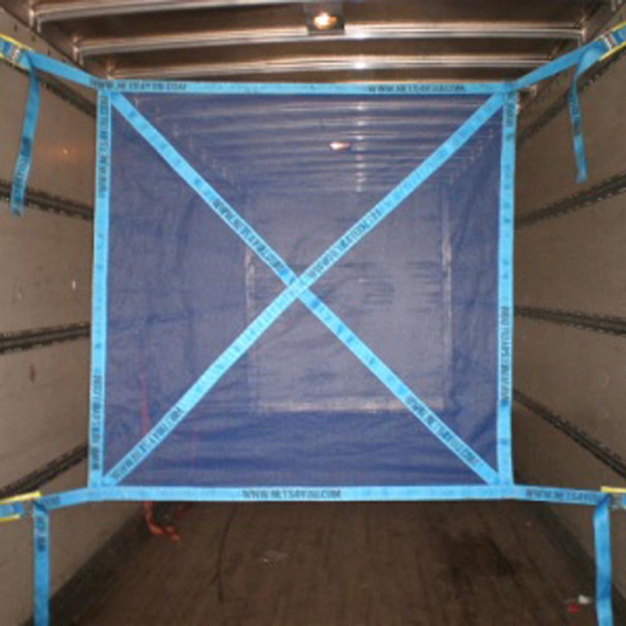 Load restraint net fitted in a vehicle.