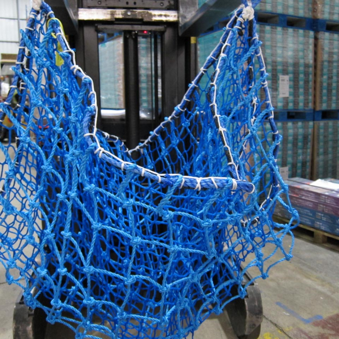 Blue rope hoist net overlaid with a blue knotless net