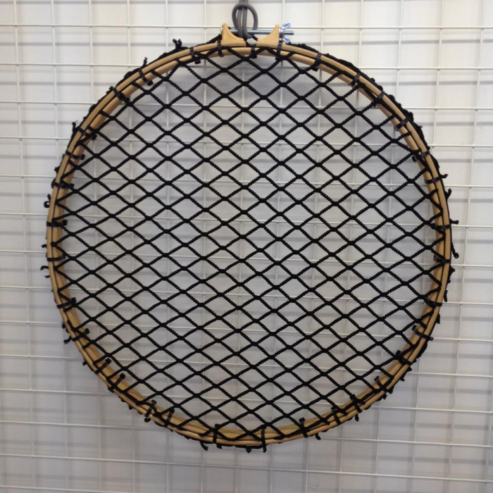 Custom-made round shaped elasticated net on a frame for use as a rugby training net.