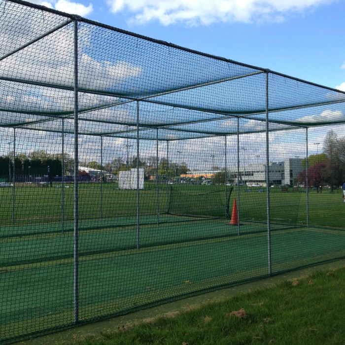 Netting around sports practice cages in a sports field.